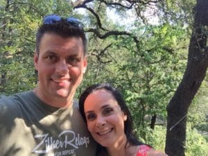 Smiling couple selfie in sunny forest