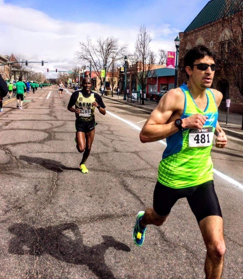 Two runners competing in city road race
