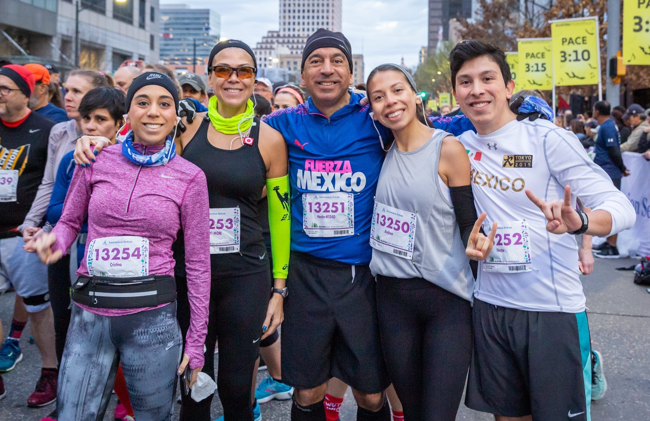 Group photo of friends before running the 2019 Austin Half Marathon. Running with friends is a great beginning running tip.