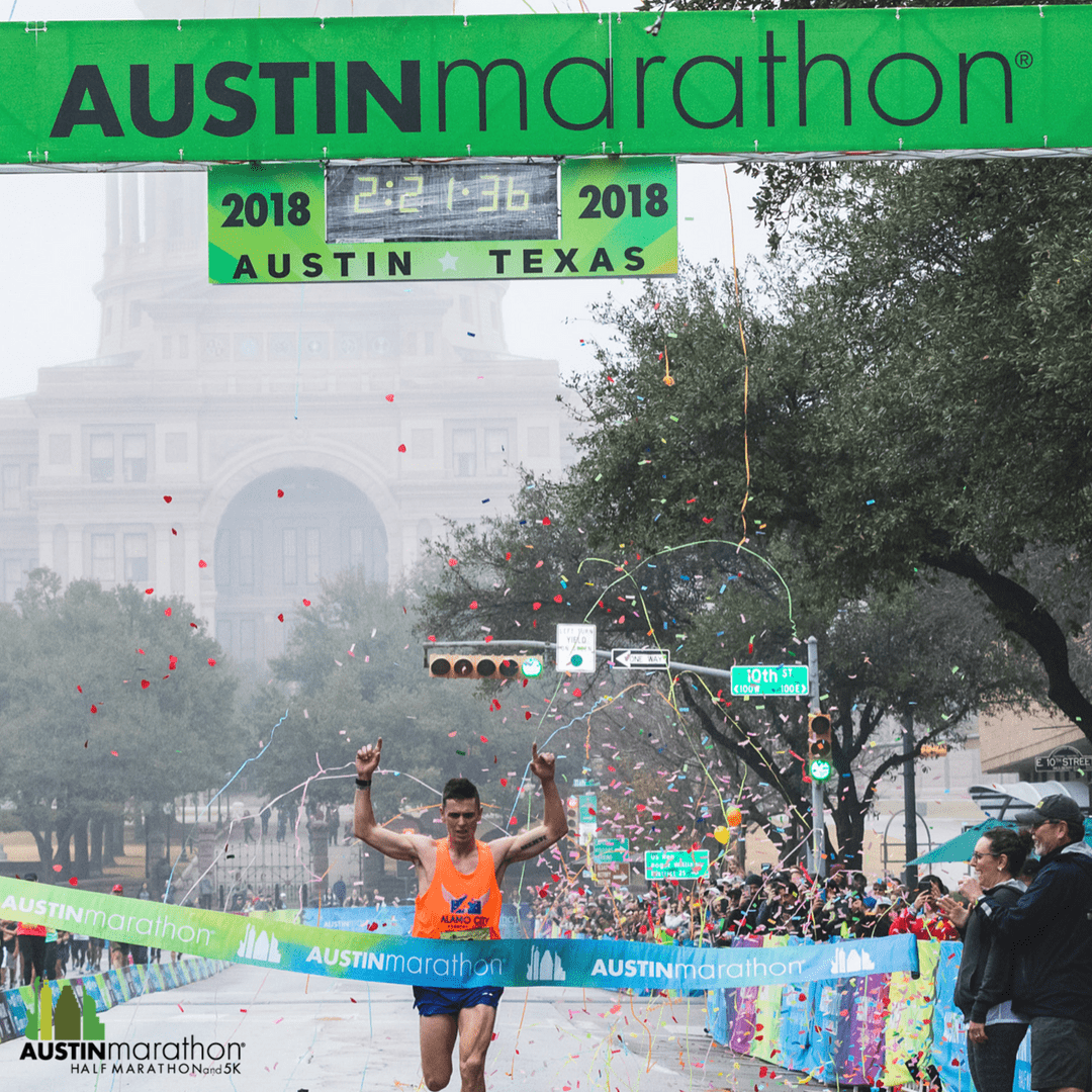 Joey Whelan crossing the 2018 Austin Marathon finish line.