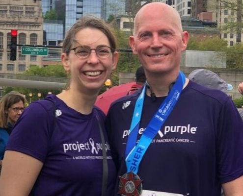 Tom and his wife, Laura, after running a race for Project Purple, a nonprofit whose mission is to find a cure for pancreatic cancer.