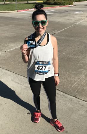 Brittany Drennan poses with a half marathon finisher medal. Read her edition of My Running Story to learn how she's been given the opportunity to run again.