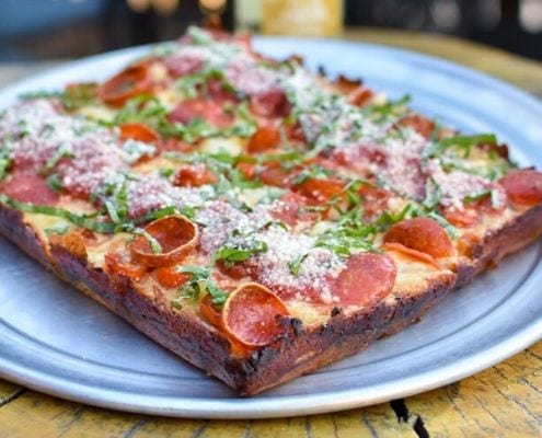 Image of a Detroit-style pepperoni pizza from Via 313. Via 313 is one of 5 Austin restaurants along the Austin Marathon course that people should visit.