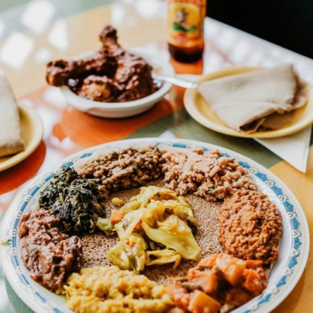 Image of several Ethiopian dishes from Aster's Ethiopian Restaurant. Aster's Ethiopian Restaurant is one of 5 Austin restaurants along the Austin Marathon course that people should visit.