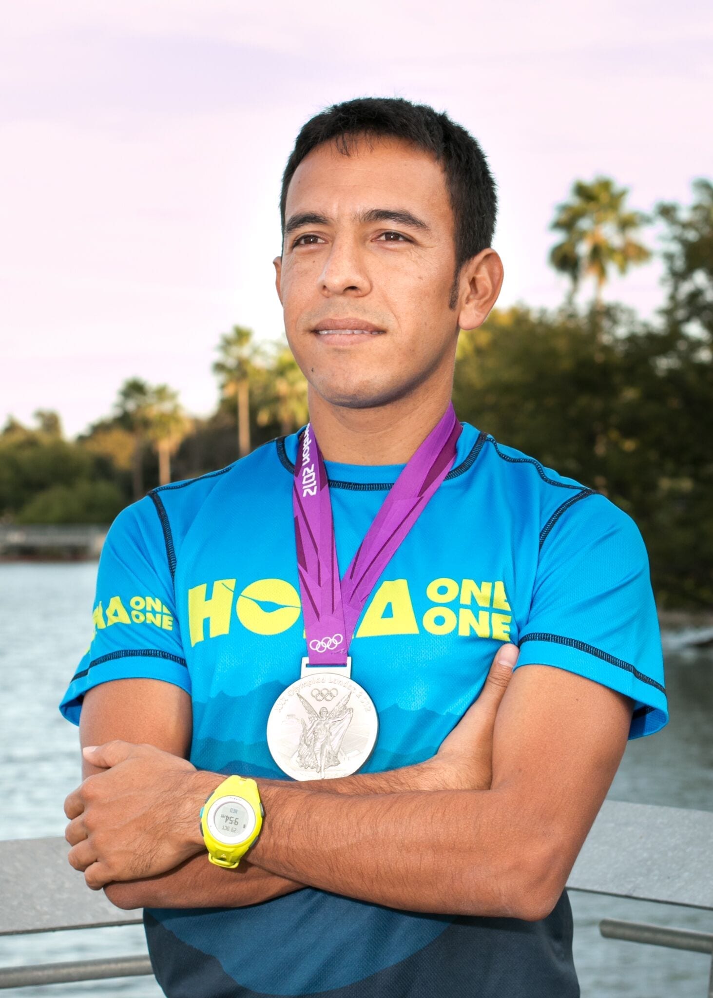 Leo Manzano, Austin Marathon Race Ambassador, poses with his Olympic silver medal. Manzano takes you back to his first sub-four-minute mile in this blog post.