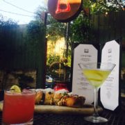 Image of drinks and appetizers at Botticelli's outdoor space in the back. They're one of the Austin Marathon's five recommended south Austin restaurants. Credit: Botticelli's Facebook page.