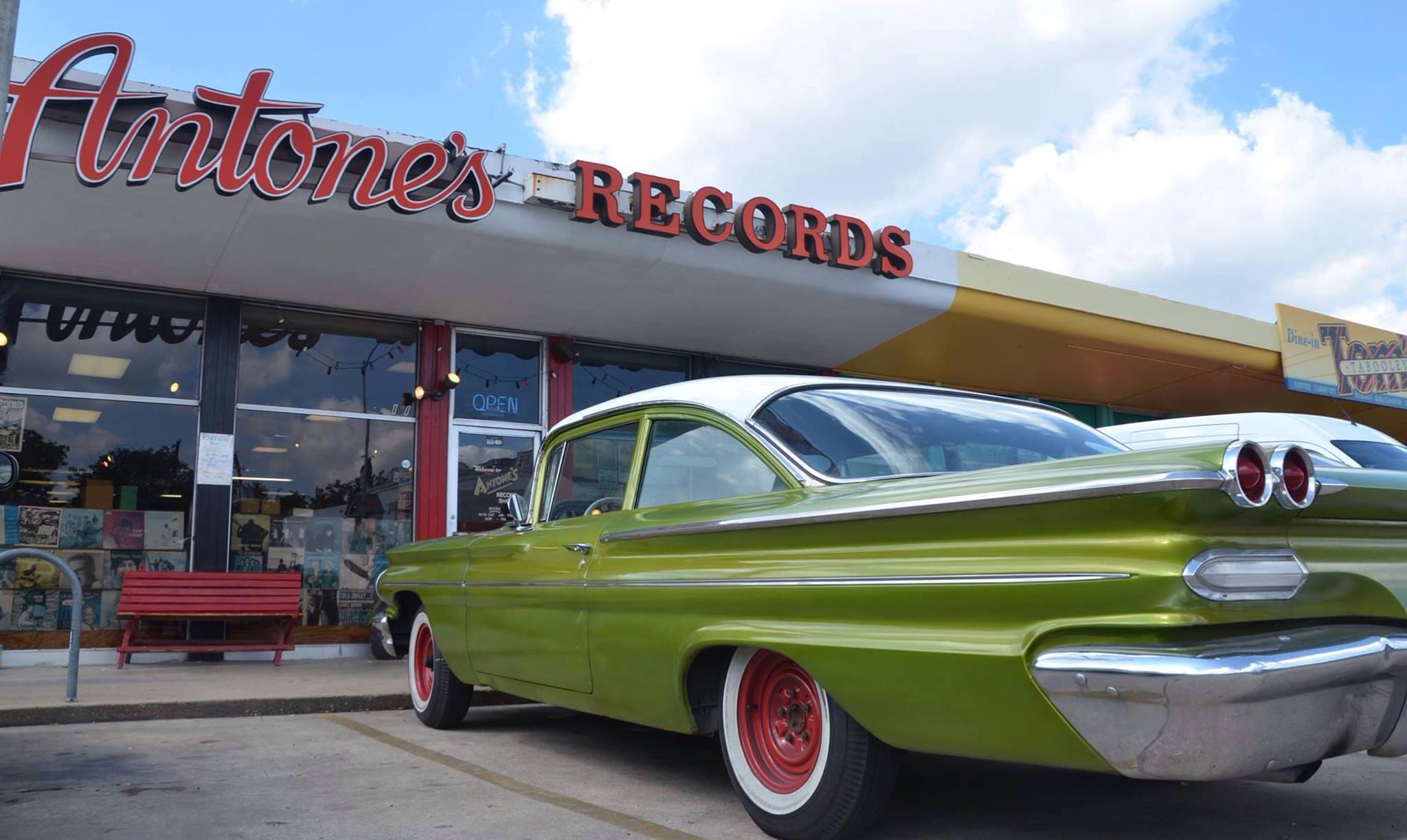 Image of a classic car in front of Antone's Record Shop. Check out our list of places to visit along miles 13-18 of the Austin Marathon course the next time you explore Austin.