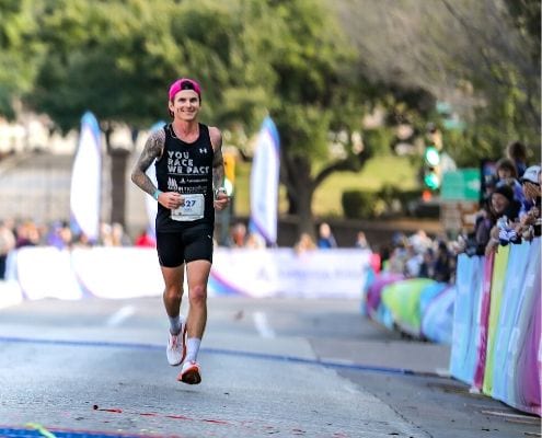 Image of Rory Tunningley crossing the 2019 Austin Marathon finish line as a pacer. Tunningley is included in the fourth round of elite runners accepted to the 2020 Austin Marathon.