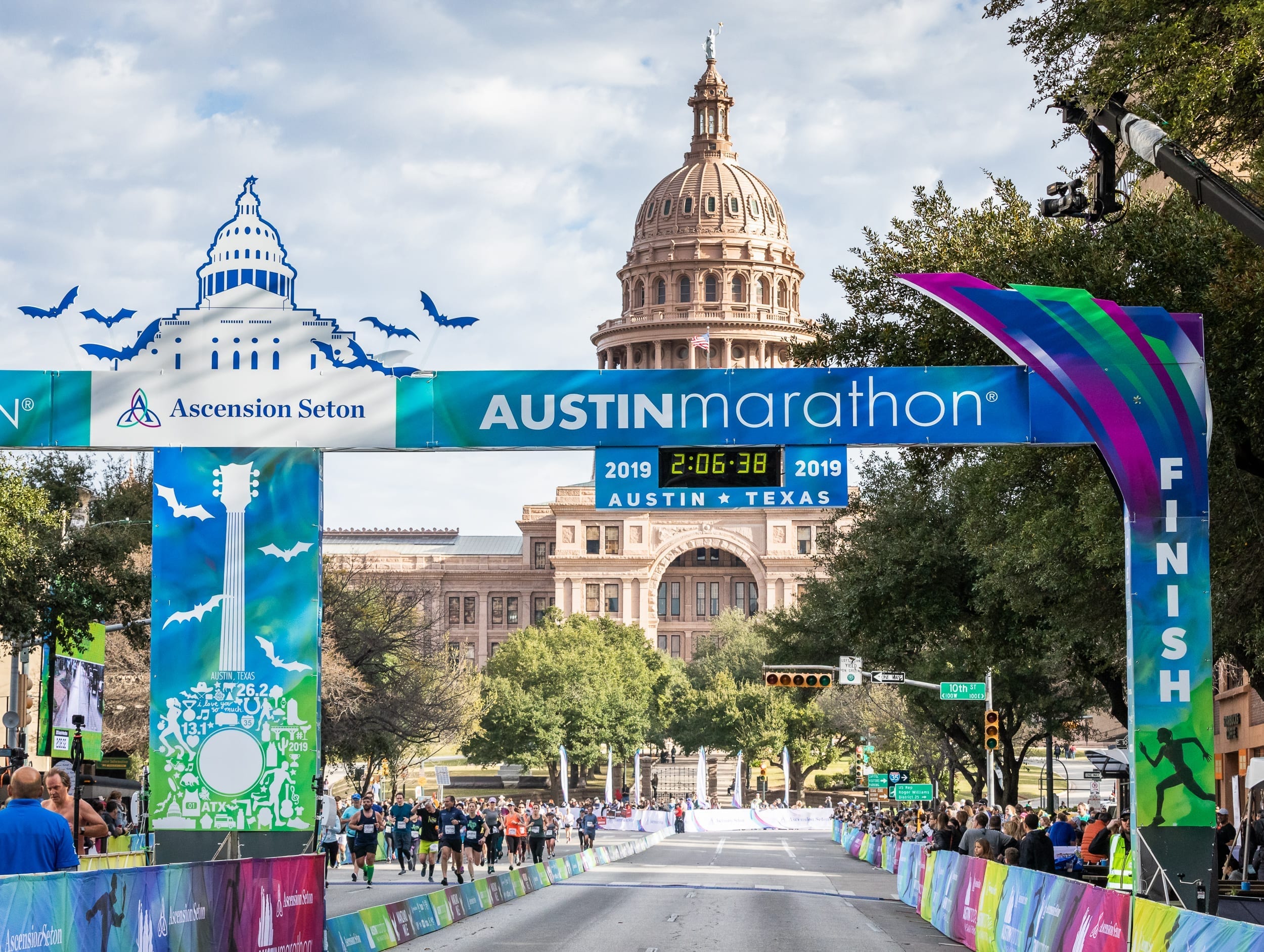 Image of the 2019 Ascension Seton Austin Marathon finish line with the Texas State Capitol in the background. Follow the GU Energy Labs advice in this blog about proper nutrition to help you get to the 2020 Ascension Seton Austin Marathon finish line.