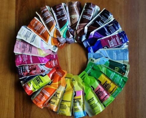 Image of GU Energy Gels arranged in a circle according to their colors. Every marathoner needs proper nutrition. Follow the GU Energy Labs advice in this blog about proper nutrition to help you get to the 2020 Ascension Seton Austin Marathon finish line.