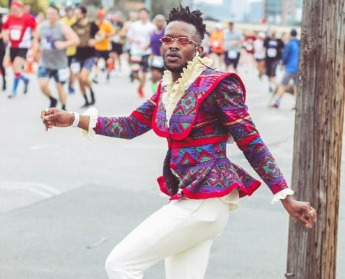 Drake Muyinza poses in his second outfit during the Austin Marathon. He turned the 26.2-mile course into the World's Longest Fashion Runway!