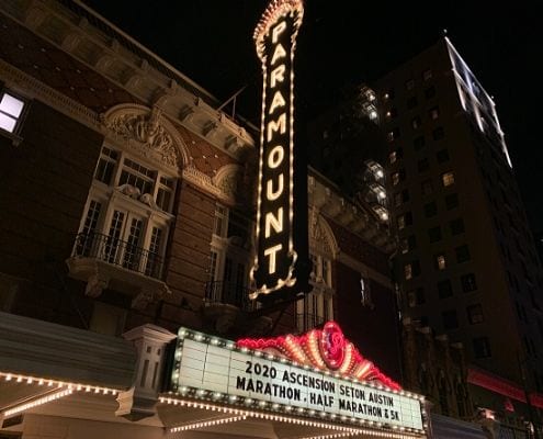 Image of the Paramount Theatre marquee displaying the 2020 Ascension Seton Austin Marathon name. The Austin Marathon donates nearly $23,000 to Paramount Theatre. Paramount is the beneficiary of the KXAN SimpleHealth 5K.