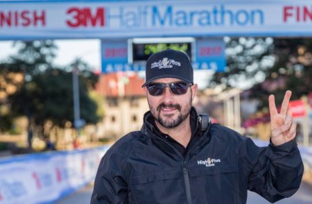 Image of Jack Murray showing the peace sign at the 2017 3M Half Marathon. Read this blog to meet High Five Events.