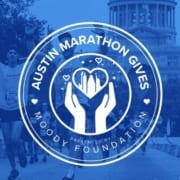 Runners cross the 2020 Austin Marathon finish line with the Texas State Capitol in the background. Overlaying the image is the new logo of Austin Marathon Gives, the Austin Marathon's philanthropic program. Learn more at https://youraustinmarathon.com/austin-marathon-gives/