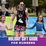 Image of a mom running towards the Austin Marathon finish line with her two children. Text on design reads 2020 Holiday Gift Guide. Learn more at http://48d.435.myftpupload.com/2020-holiday-gift-guide/