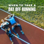 Male and female runner lay on the track after a workout. Text on design reads When to Take a Day Off Running. Read more at http://48d.435.myftpupload.com/take-a-day-off/