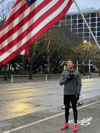 Nate Boyer covers his heart with his right hand as the National Anthem played before he ran 26.2 miles on Austin’s streets. Boyer helped fundraise more than $21,000 for Dell Children’s Heart Program.