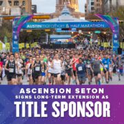 Runners take off with the Ascension Seton Austin Marathon start line in the background. Text on design reads Ascension Seton Signs Long-Term Title Sponsor Extension. Read more at http://48d.435.myftpupload.com/ascension-seton-title-sponsor-extension/