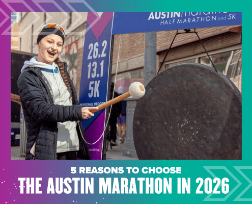 A smiling runner wearing a medal strikes a large gong at an outdoor event. Race distance signs for 26.2, 13.1, and 5K are visible. Text: "5 reasons to choose the Austin Marathon in 2026. Austin Marathon Half Marathon & 5K