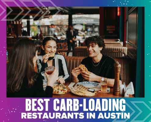 Three friends enjoy pizza and drinks at a restaurant in Austin, smiling and laughing together. The image is overlaid with the text “Best Carb-Loading Restaurants in Austin.”. Austin Marathon Half Marathon & 5K