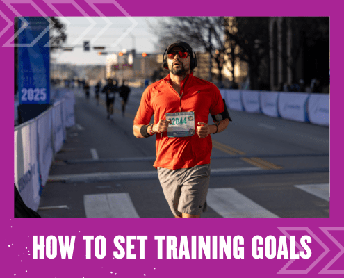 A man wearing a red shirt, shorts, and sunglasses runs a race on a city street, with a race bib pinned to his shirt. The text below reads, "How to Set Training Goals" on a purple border—perfect inspiration to set training goals of your own. Austin Marathon Half Marathon & 5K