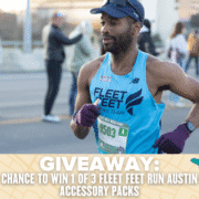 A male runner in a blue "Fleet Feet Running Team" tank, purple gloves, and a blue cap races ahead. The banner below reads: “GIVEAWAY: Chance to win 1 of 3 Fleet Feet RUN AUSTIN accessory packs.”. Austin Marathon Half Marathon & 5K