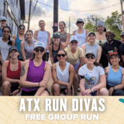 A group of smiling women in athletic wear pose outdoors by a pink food truck. Text below reads "ATX Run Divas Free Group Run" on a map-themed background. A dog is visible on the right, highlighting this fun and free community group run. Austin Marathon Half Marathon & 5K