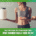 A woman in athletic wear holds a large jar in one hand and a wooden tray with fruit, cheese, and nuts in the other. Text below reads: "Nutrition Myths Busted: What Runners Really Need to Eat." Discover what to eat for peak running performance. Austin Marathon Half Marathon & 5K