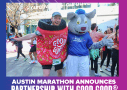 Two people at the Austin Marathon: one is dressed as a jar of GOOD GOOD strawberry jam, the other as a wolf mascot in an “Austin Marathon” shirt. Both are smiling with arms outstretched, celebrating the Ascension Seton partnership announcement. Austin Marathon Half Marathon & 5K