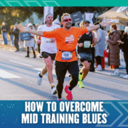 A smiling runner in an orange shirt raises his arms in celebration while running a race with other participants. The text at the bottom reads, "How to Overcome Training Slump. Austin Marathon Half Marathon & 5K