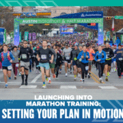 Runners take off at the starting line of the Austin Marathon & Half Marathon, with a large crowd behind them and race banners overhead. Text reads, "Launching into marathon training: Set your marathon training plan in motion. Austin Marathon Half Marathon & 5K