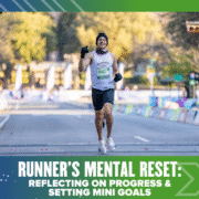 A smiling runner in a race, wearing a white tank top and black gloves, lifts his arms in celebration as he nears the finish line—capturing the power of a runner’s mental reset by reflecting on progress and setting mini goals. Austin Marathon Half Marathon & 5K
