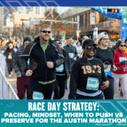 Runners smiling and walking at the Austin Marathon, wearing race bibs and cold-weather gear, with a city street and spectators in the background. Text below reads: "Race Day Strategy: Pacing, Mindset, When to Push vs Preserve. Austin Marathon Half Marathon & 5K
