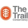 The Trail Conservancy logo features an orange emblem with a white stylized tree and "TC" initials, alongside the words "The Trail Conservancy" in bold gray text—perfect for Austin Marathon fundraising or Run For Charity events. Austin Marathon Half Marathon & 5K