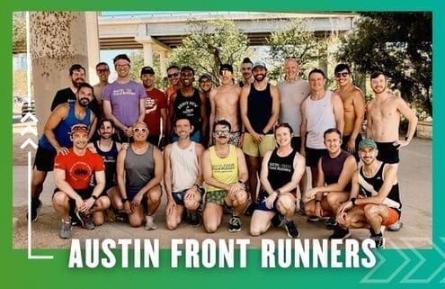 A group of about 20 smiling runners from the Buda Running Club pose together outdoors under a bridge, some standing and some kneeling. They wear athletic gear, with “AUSTIN FRONT RUNNERS” text on a green background. Austin Marathon Half Marathon & 5K