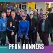 A group of cheerful runners from the Buda Running Club pose together outside a building, dressed in athletic clothing and smiling at the camera. The caption "PFUN RUNNERS" appears at the bottom of the image. Austin Marathon Half Marathon & 5K