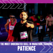 A marathon runner in a black shirt and race bib 34999 points toward the camera, surrounded by fellow runners on a city street. Text reads: "The most underrated skill in marathon training: Patience. Austin Marathon Half Marathon & 5K